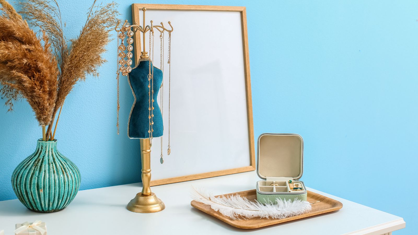 A stylish necklace organiser and jewellery organiser box on a table