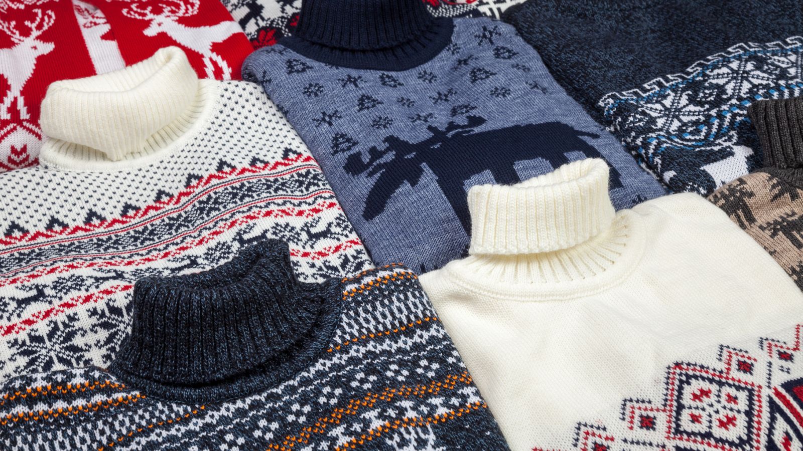 A collection of knitted Christmas jumpers. 
