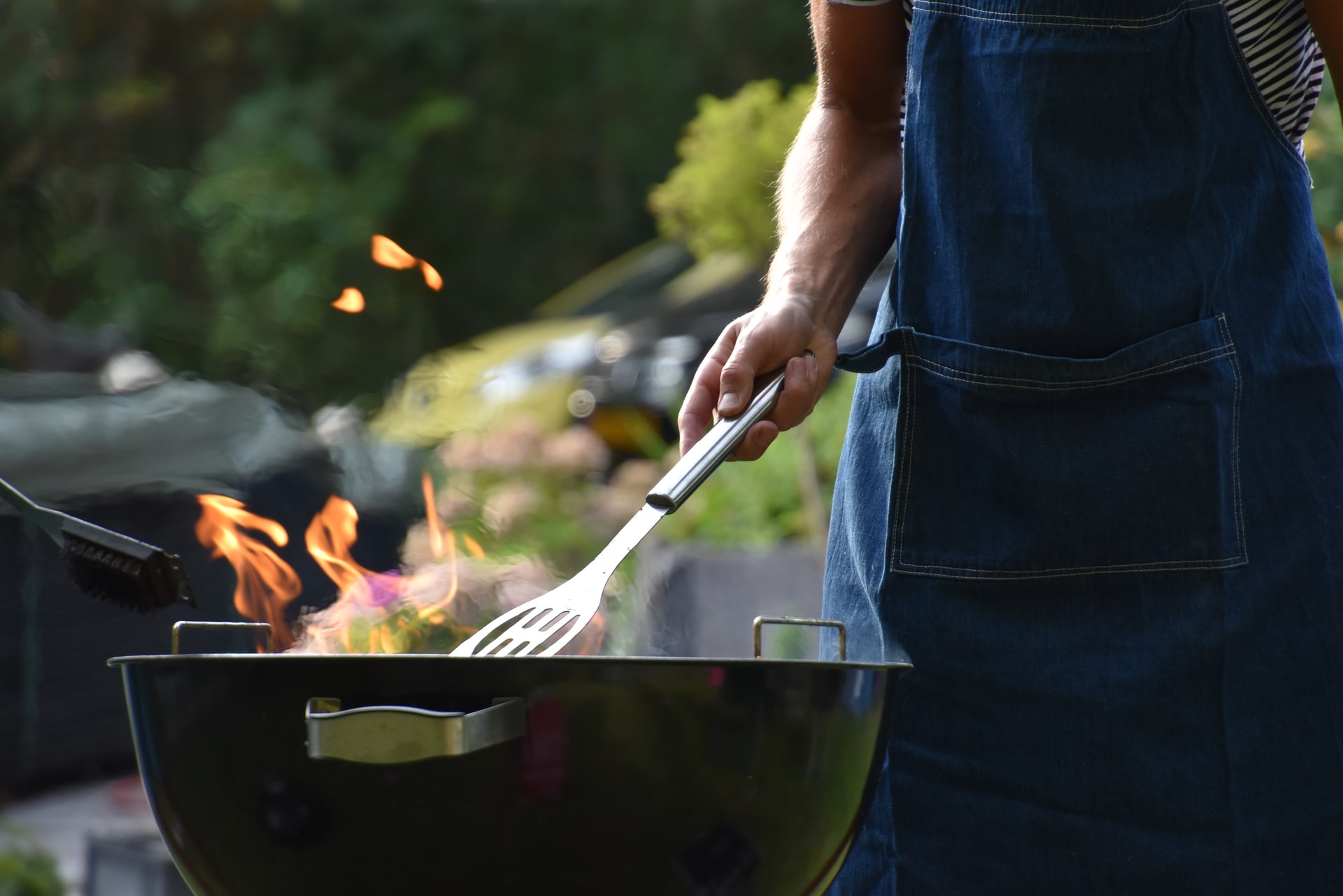 Man grilling summer items decluttering for winter